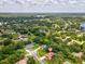 Expansive aerial view showcasing lush surroundings and the property's prime location at 18803 Misty Shores Ln, Lutz, FL 33548
