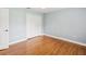 Bright bedroom with hardwood floors, shutters, a ceiling fan, and a closet at 18803 Misty Shores Ln, Lutz, FL 33548