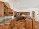 A large kitchen features wood cabinets, granite counters, and stainless steel appliances at 18803 Misty Shores Ln, Lutz, FL 33548
