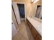 Bathroom with a dual sink vanity and a tub/shower combo with dolphin shower curtain at 19239 Stone Hedge Dr, Tampa, FL 33647