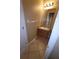 Cozy bathroom features a vanity with wooden cabinets, a mirror and tile floor at 19239 Stone Hedge Dr, Tampa, FL 33647