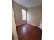 Comfortable bedroom featuring hardwood floors and a sunlit window at 19239 Stone Hedge Dr, Tampa, FL 33647
