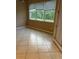 Bright bedroom featuring tiled floors and a big window at 19239 Stone Hedge Dr, Tampa, FL 33647
