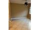 Bedroom featuring tile flooring, neutral colored walls, and a ceiling fan at 19239 Stone Hedge Dr, Tampa, FL 33647
