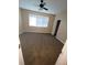 Large bedroom with neutral walls, a ceiling fan, blinds, and a closet in the background at 19239 Stone Hedge Dr, Tampa, FL 33647