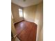 This bedroom features beautiful hardwood floors and neutral-colored walls at 19239 Stone Hedge Dr, Tampa, FL 33647