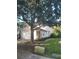 Charming two-story townhome with a neutral color scheme, featuring a two-car garage and mature landscaping at 19239 Stone Hedge Dr, Tampa, FL 33647