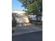 Attached two-car garage with a white door and stone accents, offering ample parking and curb appeal at 19239 Stone Hedge Dr, Tampa, FL 33647