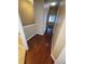 Hallway with hardwood flooring leading to rooms with neutral-colored walls at 19239 Stone Hedge Dr, Tampa, FL 33647