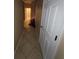 Hallway leading to wooden staircase showcasing the home's layout and design at 19239 Stone Hedge Dr, Tampa, FL 33647