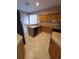 Well-lit kitchen with oak cabinets and tile floor with black appliances at 19239 Stone Hedge Dr, Tampa, FL 33647
