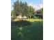 Community playground area with play equipment, grassy areas, and shady trees at 19239 Stone Hedge Dr, Tampa, FL 33647