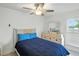 Cozy bedroom featuring a full sized bed, white dresser, and bright natural light from the window at 2306 41St E St, Bradenton, FL 34208