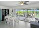 Bright dining room featuring a large sliding glass door leading to an outdoor seating area at 2306 41St E St, Bradenton, FL 34208