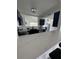 Kitchen featuring quartz countertops, navy cabinets, and stainless steel appliances at 2306 41St E St, Bradenton, FL 34208