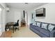 Versatile bonus room offers a comfortable sofa and desk space, perfect for relaxation or work at 2306 41St E St, Bradenton, FL 34208