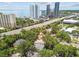 Aerial shot showing the property nestled among trees, with city skyline and waterfront views at 2506 S Obrapia St, Tampa, FL 33629