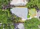 Aerial view of a well-maintained home featuring a green lawn and a private, fenced backyard at 2506 S Obrapia St, Tampa, FL 33629
