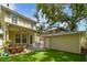 Outdoor area with a well-manicured lawn and detached garage at 2506 S Obrapia St, Tampa, FL 33629