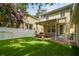 Lovely backyard with a covered patio, well-manicured lawn, and white picket fence, great for outdoor enjoyment at 2506 S Obrapia St, Tampa, FL 33629