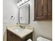 Bathroom with a sleek design, featuring a vanity with dark wood cabinets at 2506 S Obrapia St, Tampa, FL 33629