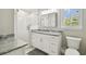 Modern bathroom with marble vanity, and a glass-enclosed shower at 2506 S Obrapia St, Tampa, FL 33629