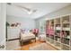 Cozy bedroom with hardwood floors, a ceiling fan, and ample storage for a belongings at 2506 S Obrapia St, Tampa, FL 33629