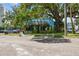 Charming commercial building with a colorful mural and ample parking on a tree-lined street at 2506 S Obrapia St, Tampa, FL 33629