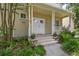 Close-up of the front porch featuring a double-door entry, decorative plants, and ample space at 2506 S Obrapia St, Tampa, FL 33629