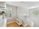 Light-filled hallway with plantation shutters, bench seat and views to the staircase at 2506 S Obrapia St, Tampa, FL 33629