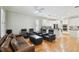 Open concept living room with media center, leather seating, and modern design elements at 2506 S Obrapia St, Tampa, FL 33629