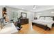 Spacious main bedroom suite with hardwood floors, light walls, and abundant natural light at 2506 S Obrapia St, Tampa, FL 33629