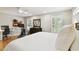 Bright and airy bedroom with multiple windows and hardwood floors, ideal for creating a peaceful retreat at 2506 S Obrapia St, Tampa, FL 33629