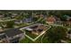 Aerial view of a single-Gathering home featuring solar panels and a fenced yard in a residential community at 25946 Buckthorn Ave, Land O Lakes, FL 34639