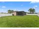The large fenced backyard with a covered patio for entertaining at 25946 Buckthorn Ave, Land O Lakes, FL 34639