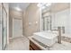 Modern bathroom with granite countertop, rectangle sink, and walk-in shower featuring glass door at 25946 Buckthorn Ave, Land O Lakes, FL 34639