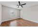 Comfortable bedroom with hardwood floors, and bright window at 25946 Buckthorn Ave, Land O Lakes, FL 34639