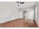 Empty bedroom showcasing sleek hardwood floors, neutral paint, and natural light at 25946 Buckthorn Ave, Land O Lakes, FL 34639