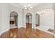 Inviting living space with arched doorways and seamless flow to the kitchen and other areas of the home at 25946 Buckthorn Ave, Land O Lakes, FL 34639