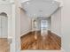 Open-concept living space featuring hardwood flooring and neutral paint, perfect for entertaining and Gathering living at 25946 Buckthorn Ave, Land O Lakes, FL 34639