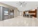 Open concept living space with seamless flow from the kitchen to the living area at 25946 Buckthorn Ave, Land O Lakes, FL 34639