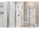 Modern bathroom shower with glass door and ceramic tiling is illuminated by natural light at 25946 Buckthorn Ave, Land O Lakes, FL 34639