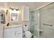 Bathroom with tile floors, shower, and a white marble vanity at 267 Countryside Key Blvd, Oldsmar, FL 34677