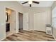 Bedroom with hardwood floors, closet, and bathroom access at 267 Countryside Key Blvd, Oldsmar, FL 34677