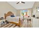 This cozy bedroom features an abundance of natural light and hardwood floors at 267 Countryside Key Blvd, Oldsmar, FL 34677