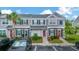 Charming townhome featuring neutral paint, dark shutters, and well-maintained landscaping in a desirable community at 267 Countryside Key Blvd, Oldsmar, FL 34677