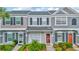 Charming townhome featuring a well-maintained exterior, landscaped yard, and inviting front entrance at 267 Countryside Key Blvd, Oldsmar, FL 34677