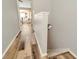 Hallway view of hardwood floors leading to living area at 267 Countryside Key Blvd, Oldsmar, FL 34677