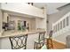 Charming kitchen with granite countertops and stainless steel appliances and a view to the staircase at 267 Countryside Key Blvd, Oldsmar, FL 34677