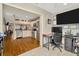 Open-concept living area showing hardwood floors, the kitchen, and a home office at 267 Countryside Key Blvd, Oldsmar, FL 34677